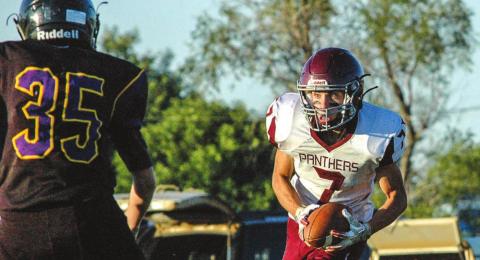 Timber Lake’s Slater Ducheneaux (7) fixes his eyes on Dupree freshman Daxton McDaniel after Ducheneaux made an interception while playing the defensive backfield during their game Friday night in Dupree. Photo by Jon Flatland