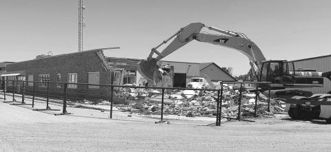 The office building that had served as Moreau-Grand Electric Co-op headquarters since 1959 is being demolished by Miller Construction of Isabel. The space will be used for parking and loading. Offices have been moved to the new headquarters building on the same block, facing Main Street. Photo by Kathy Nelson