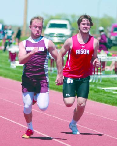 Timber Lake senior Jayden Miller edged Bison’s Rylee Veal at the finish line of the 100 meter run during the Region 8B track meet last Friday, May 19. Miller won the region title and qualified for the State track meet this weekend in Sioux Falls. Photo by Jon Flatland