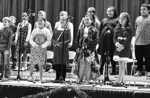 Timber Lake Elementary students, under the direction of K-12 music instructor Walker Rose, entertained the audience with a concert of holiday music on December 5. Above: Third graders. Right: Fourth graders .