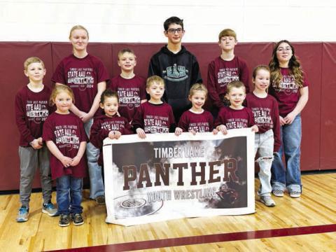 Timber Lake wrestlers who qualified for the State AAU tournament. FRONT, l-r:Lyllian Tesch, Ramzi Veit, Ryder Spiel, Rowan Maher, Trevor Aberle, Elizabeth Keller; BACK: TK Paxton, Emily Gill, Keaton Jones, Levi Berndt, Taggen Paxton, Selena Longbrake. Photo by Kathy Nelson