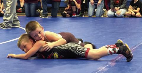 Trevor Aberle, top, of the Timber Lake Youth Wrestling Team, works against an opponent at the Lemmon-McIntosh Youth Wrestling Tournament last Sunday, Feb. 4, in Lemmon. Aberle went 3-0 on the day and captured first place honors in the 5-6 Boys 47-50 B division. Courtesy Photo