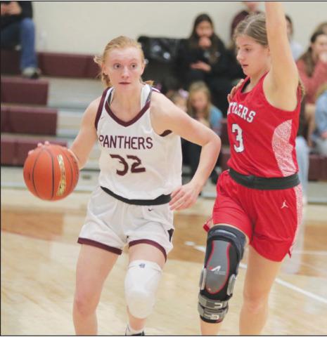 Sophomore guard Jordan Jones (32) is pressured by Potter County’s Rylee Kaup (3) while bringing the ball up court during Timber Lake’s 60-56 win over the previously-unbeaten Battlers last Friday, Jan 6. Photo by Jon Flatland