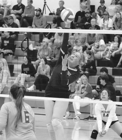 LEFT: Timber Lake’s Sara Holzer and Jasmine Nash attempt to block a spike from Herreid-Selby’s Pausha Meidinger during the Mobridge-Pollock Invitational on Saturday, Sept. 10. Looking on for Timber Lake is Carlie Lawrence (3). ABOVE: McIntosh senior Chloe Sandland hammers a spike against Cheyenne-Eagle Butte. Photos by Jon Flatland