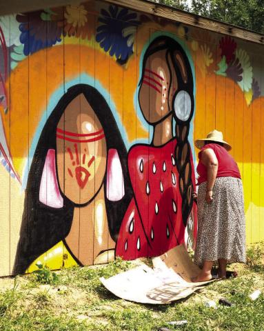 The 10th annual RedCan Invitational Graffiti Jam got underway Wednesday, July 10 in Eagle Butte. This year’s event features more than a dozen artists from across the nation and from as far away as New Zealand. Above, one of last year’s artists puts the finishing touches on her mural in Eagle Butte.