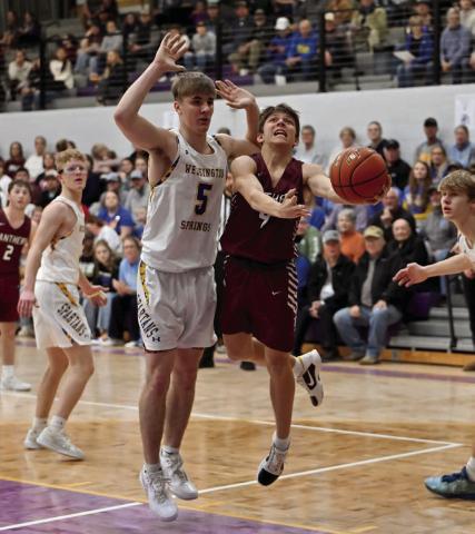 Timber Lake freshman Broc Bauer (right) came off the bench to score five points during the Panthers’ loss to Wessington Springs in the SoDak 16 last week. See Page 10 for game coverage. Photo by Marie DuPreez