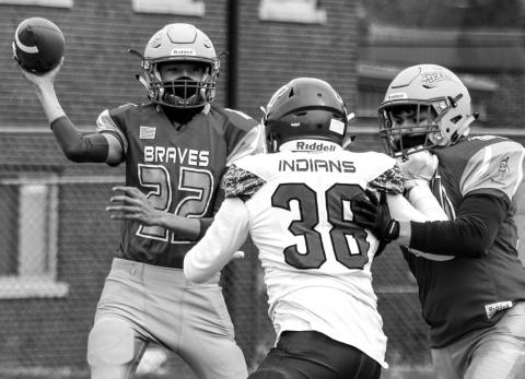 Cheyenne-Eagle Butte quarterback Ayden Sampson (22) passes the ball during the All Nations Conference football opener Friday at Eagle Butte. Photo by Jon Flatland