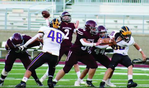 Timber Lake quarterback Cole Ducheneaux (2) fires a pass from the pocket behind pass protection from linemen Rylan Keller (55), Mason Bickel (54) and Chris Peterson-Lemmon (44) during the Panthers’ 3814 win over the Wolverines last Friday at Northern State University’s Dacotah Bank Stadium in Aberdeen. Ducheneaux threw for a season-high 225 yards and three touchdowns and was only sacked once as Timber Lake improved to 3-2 on the season. Photo by Jon Flatland