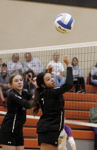 Timber Lake’s Geana Bollinger (left) and Kessa Bigger react to a partially blocked spike during a regular season matchup with Newell. The Panthers downed the Irrigators last week in the Region 8B Tournament. Photo by Jon Flatland