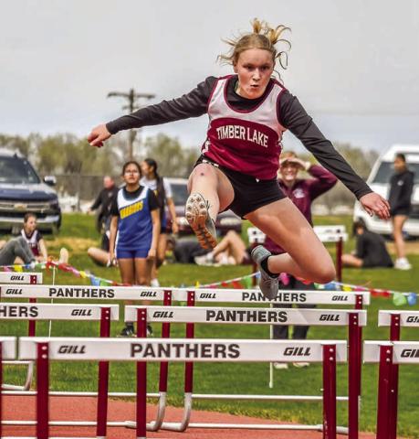 Eighth grader Evelyn Gill sales over a barrier in the 200 meter hurdles at the Timber Lake JV Track Invite last week. Gill took top honors in the event with a time of 37.32 seconds Photo by Marie DuPreez