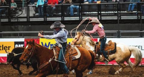 Rope Roghair and Sage Burress of Isabel win the team roping at the Wrangler 20x in Rapid City this week. Photo courtesy of Bryan Bender Photography