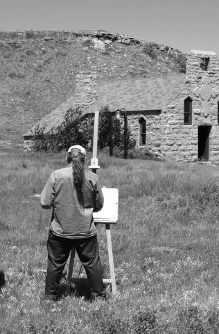 Standing Rock artist Del Iron Cloud, shown here painting the Old Stone Church on Firesteel Creek in 2012, will be the guest artist at the Timber Lake Museum during the Days of 1910, July 24 and 25.