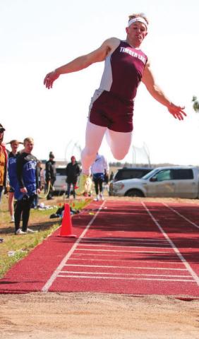 Timber Lake senior Hank Kraft leaps for a triple jump mark during the Timber Lake Invitational meet April 26. Photo by Jon Flatland