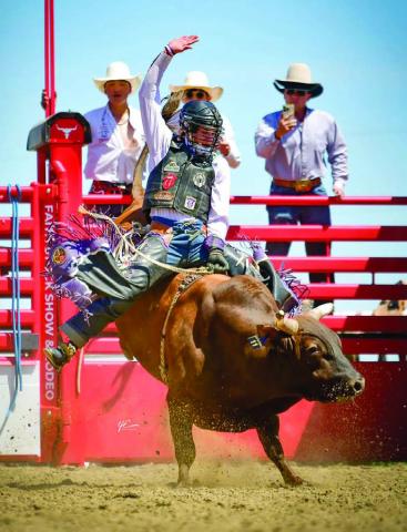 Timber Lake High School’s Wynn Lawrence of Whitehorse won the bull riding event at the Northwest Region Rodeo in Buffalo last weekend with this 71 point ride and qualified for the State High School Finals Rodeo June 17-21 in Ft. Pierre. Lawrence also won the opening round of saddle bronc riding and finished third overall. Photo by Chuck Miner