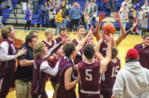 The Timber Lake boys basketball team celebrates its Region 8B finals victory over Lemmon. Photo by Jon Flatland