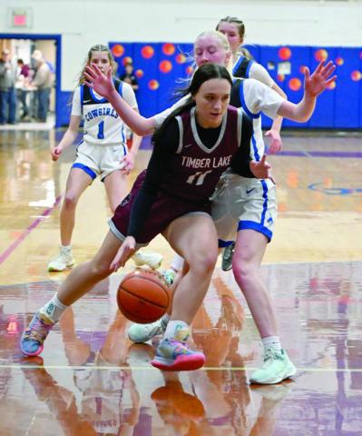 Sophomore guard Kiya Mowrer dribbles past a Lemmon Cowgirl defender during girls basketball action last Friday, Dec. 13. Lemmon upended the Lady Panthers 57-28. Topic photo by Marie DuPreez