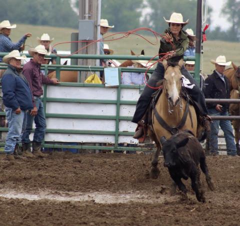 Acacia Anderberg of Mobridge throws her rope as she competes in the ladies breakaway event at the Isabel Rodeo on Saturday, Aug. 2. High winds, torrential rain and lightning forced the postponement of Friday night’s rodeo action until Saturday afternoon. Photo by Jon Flatland