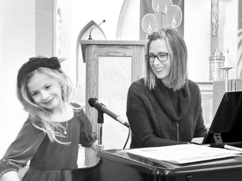 Rowan Maher and her vocal teacher, Colette Schaffer, were all smiles after Rowan sang “Silent Night” for a full-house audience at the Community Winter Celebration at Holy Cross Church on Sunday, December 1. Performers from Holy Cross, United Parish and New Hope shared their talents.