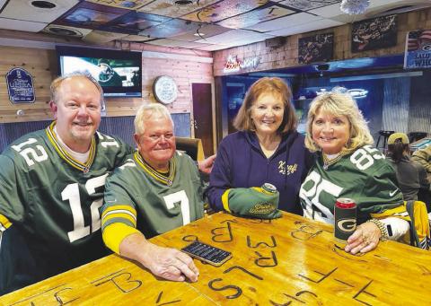 Several Green Bay/Tucker Kraft fans from Wisconsin drove to Timber Lake to watch the Packers game with other fans at The Corner Bar and Grill on Monday night. Pictured with Tucker’s grandmother, Linda Kraft (in blue), are (l-r) Steve Wikel of Waupaca, WI and Ottis and Sue Smith of Grand Chute, WI. Although Tucker is out for the season with an injury and the Packers lost to the Philadelphia Eagles 10-7, the Wisconsin fans said it was worth the 1200 mile trip.