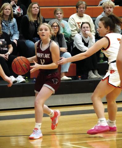 Panther guard Kenlea Heck, a 5-1 senior, surveys the floor while bringing the ball upcourt during action against the Faith Lady Longhorns last Tuesday, Jan. 2. Photo by Marie DuPreez