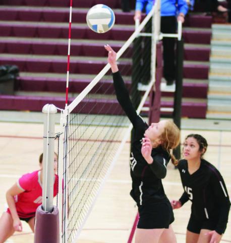 Kendyl Locken, a 5-10 junior, tips a shot over the net during Timber Lake Lady Panther volleyball action against Potter County on Monday, Oct. 17.