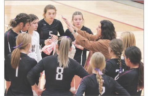 Timber Lake Lady Panther Head Coach Megan Bickel goes over strategy with her team between games of a match with the Newell Irrigators last Friday, Oct. 21. Timber Lake and Newell went into the game sitting one-and-two atop the Region 8B standings with the Lady Panthers winning a 3-game sweep to avenge a loss to the Irrigators in the championship match of the Little Moreau Conference Tournament in September. Photo by Jon Flatland