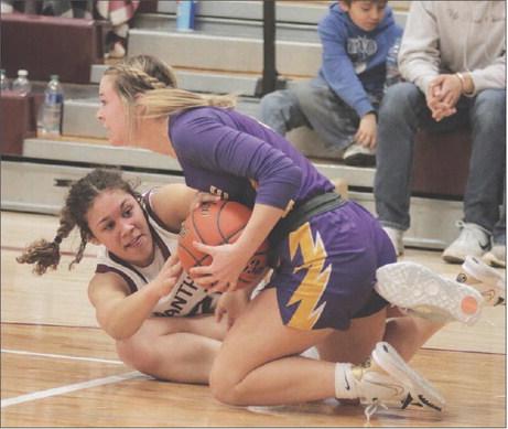 Timber Lake sophomore forward Jasmine Nash (left) and Dupree senior guard RaeLynn Vines battle on the floor for possession of a loose ball during non-conference girls’ basketball action between the Lady Panthers and Lady Tigers last Tuesday, Jan. 31, in Timber Lake. Dupree held off a late rally to defeat Timber Lake 50-42, handing the Lady Panthers just their third loss of the season. For more game coverage, turn to Page 5B. Photo by Jon Flatland