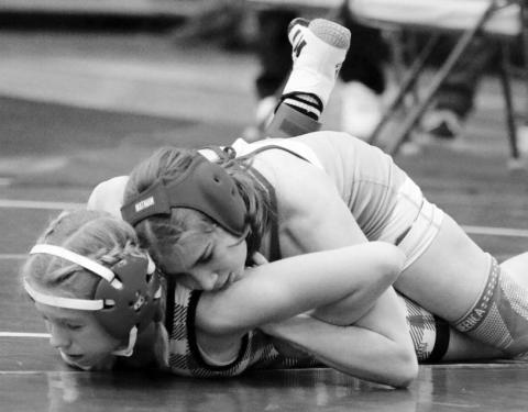 Cheyennne-Eagle Butte-Dupree wrestler Eulayla Maynard rides Zoey Donovan of Chamberlain during the Big Dakota Conference Tournament in Ft. Pierre on Saturday, Feb. 4. Maynard, 15-6 on the season, finished second overall in the Girls’ 106-pound division. Photo by Jon Flatland