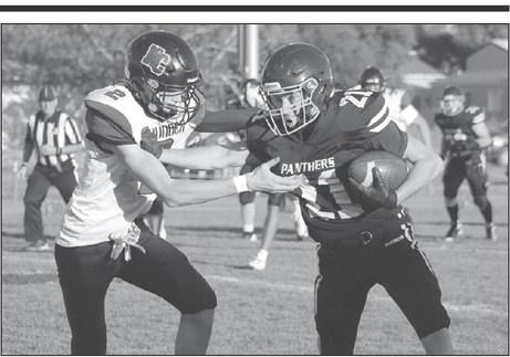 Timber Lake wide receiver Eddie Keller stiff-arms a would be North Central defender during football action at Kraft Field last Friday, Sept. 6. Keller shed the tackler and turned this short reception from quarterback Cole Ducheneaux into a 50-plus yard touchdown. Photo by Jon Flatland