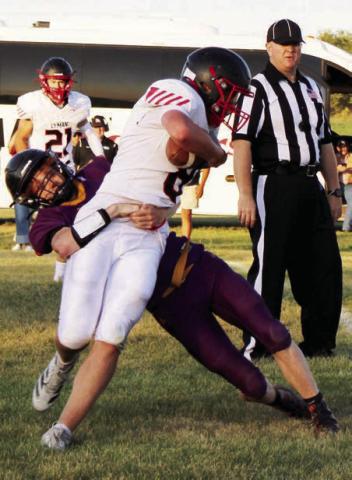 Dupree senior Fletcher Birkeland tackles a Lyman runner during the Tigers football seaaon opener. Dupree knocked off North Central last Friday, Aug. 29, and faces unbeaten Hill City this Friday, Sept. 5, in Hill City. The Rangers are 2-0 after lopsided wins over Stanley County and Lemmon-McIntosh.  Photo by Patty Peacock
