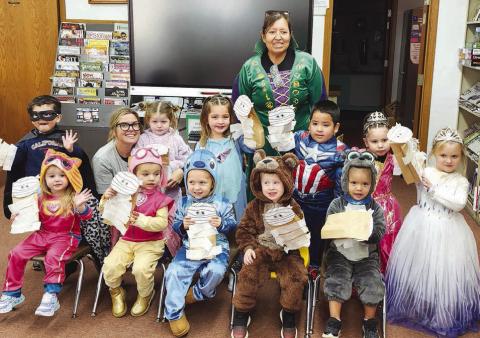 Timber Lake Head Start kids enjoyed a visit to the Dewey County Library on October 30 where they listened to a story and made a craft. Front (l-r) are Mia Linderman, Reagan Kraft, Kara Aberle, Dexter Aberle, Tomi White; middle: Antonio Loaiza-Montiel, Kacey Long, Haysley Long, Shiloh Smith, Khalil Thompson, Leyla Bullhead, Nora Serr; back: teacher Nina Schumacher.
