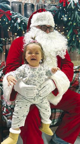 Not everybody was happy to visit with Santa Claus during Timber Lake’s Hometown Christmas event last Friday. Neva Vogel voices her displeasure in meeting the jolly old fellow.