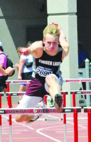 Timber Lake’s Gracen Hansen clears a hurdle during the State Class B Track meet in Sioux Falls last week. Hansen finished fifth overall in the 300 meter hurdles and was sixth in the triple jump. Photo by Mary Farlee