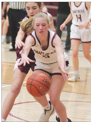 Junior Averie Marshall goes after a loose ball during Timber Lake’s win over McIntosh in the opening round of the 2023 LMC Tournament last Thursday, Jan. 19. The Lady Panthers were upset in the semifinal round by Lemmon and finished third in the tournament. Photo by Jon Flatland