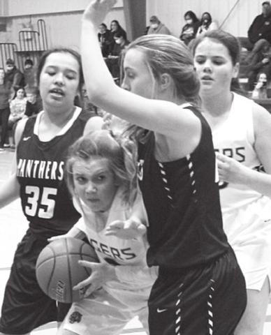 Dupree sophomore Kennedy McLellan works the ball inside against the defense of Timber Lake’s Kessa Bigger (35) and Mckenzi Vomacka. Photo by Patty Peacock