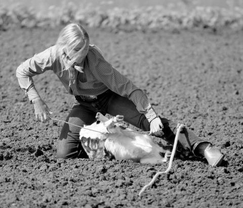 Lainee Gebhart of Meadow competes in the goat-tying competition at the Dewey County 4-H Rodeo in Timber Lake on Sunday, May 28. Photo by Jon Flatland