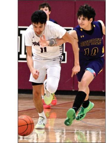Timber Lake senior Tristan Dupris (11) is fouled by Dupree’s Jayden Taken Alive (10) during non-conference boys basketball action earlier this season. The Panthers close out their regular season schedule on Friday Feb. 23, against Potter County in Gettysburg. Photo by Marie Du Preez