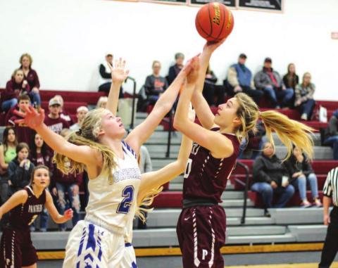 Timber Lake sophomore Shay Kraft puts up a shot against Lemmon’s Allie Kohn during their Little Moreau Conference tournament game in Faith on Saturday. Photos by Jon Flatland