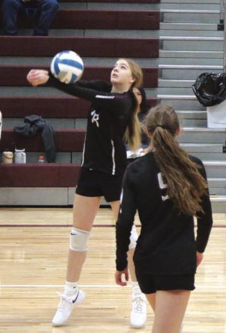 Timber Lake sophomore Gailup Bollinger bumps a shot as teammate Sara Holzer looks on during recent Lady Panther volleyball action. Photo by Jon Flatland