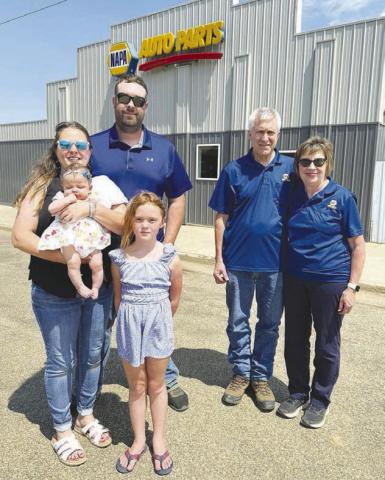 Max and Pam Schott (left), with daughters Grace and Remy, are the owners of Schott Sales, LLC, formerly Biegler Equipment in Timber Lake. The Schotts say they want to continue the same service that Bart and Marlene Biegler (right) have provide to customers for 37 years. You can watch for Schott’s Sales in the Days of 1910 parade on Saturday. Photo by Kathy Nelson