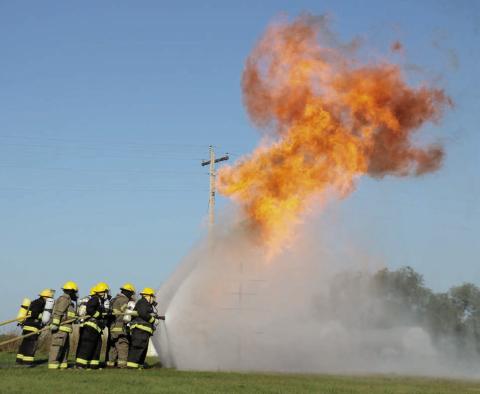 About 70 firefighters from area communities took part in a Northwest District Fire School in Isabel on Sunday, Sept. 21. Firefighters trained on handling propane fires, wildland firefighting techniques, vehicle extrication, and electrical fires and safety. Photo by Jon Flatland