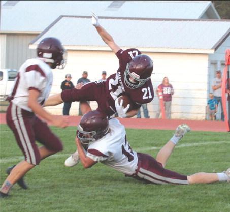 Timber Lake junior defensive back Eddie Keller (21) gets upended by a Newell defender while returning an interception in the second quarter of the Panthers’ 52-0 win over the Irrigators at Kraft Field last Friday, Sept. 1. Timber Lake, 2-1 overall, hosts the 1-2 Dupree Tigers this Friday, Sept. 8, with kickoff at 6 p.m. The Tigers are coming off a 40-0 loss to unbeaten Stanley County. Photo by Jon Flatland