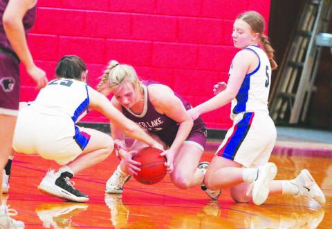 Timber Lake’s McKenzi Vomacka (center) battles North Central’s Natalie Bieber (25) and Alaina Dosch (5) for a loose ball during the Lady Panthers 59-35 win over the Thunder last Thursday, Dec. 29. Timber Lake hosts Potter County on Friday, Jan. 6, before traveling to McIntosh for a Little Moreau Conference tilt on Tuesday, Jan. 10. Photo by Jon Flatland
