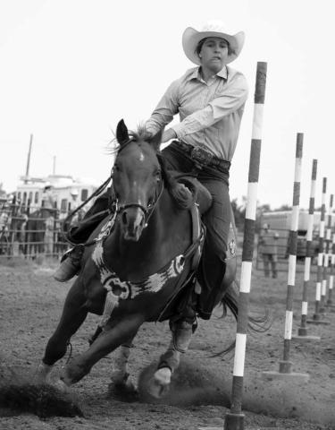 Riley Glines of McIntosh leads her horse through the poles at the 64th annual Ziebach County 4-H Rodeo in Dupree on Saturday, July 13. Glines captured top honors in the Senior Girls Poles event with a time of 22.047. Photo by Jon Flatland