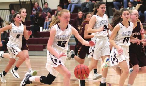 Panthers on the fast break (L-R) versus McIntosh: Joie LeBeau (2), Jordan Jones (32), Abby Linderman (21) and Natalie Lawrence (14). Photos by Jon Flatland