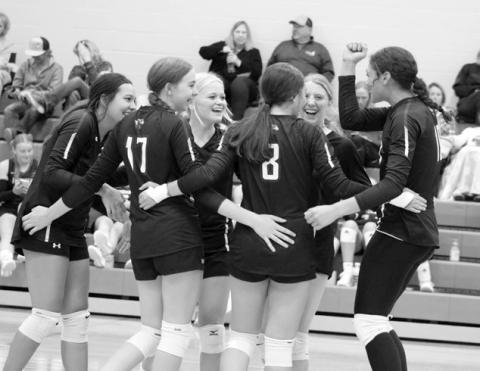 The Panthers celebrate winning a point after a hard-fought volley against Herreid-Selby in their first match at the Subway Volleyball Invitational held Saturday, Sept. 21, in Ipswich. Pictured l-r are Kessa Bigger, Geana Bollinger (17), Hailey Roggow, Jaylee Schoelerman (8), Sara Keller and Jasmine Nash. Photo by Jon Flatland