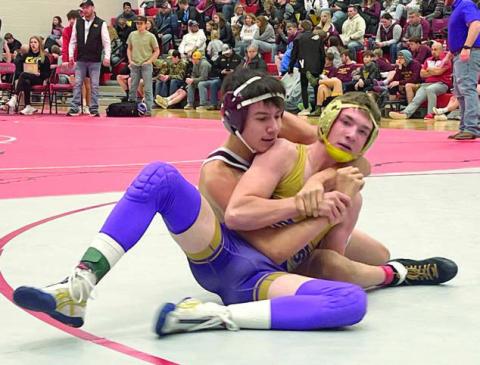 Timber Lake’s Sidney Morgan (left) works against Harding County’s Shay Smith in the 132-pound division of the Battler Wrestling Invitational in Gettysburg on Saturday, Jan. 18. Photo by Denise Perryman