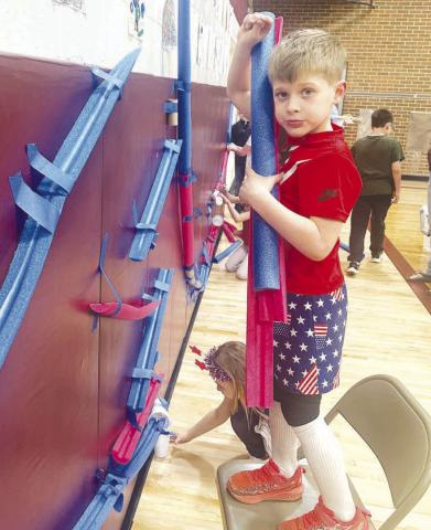 Canyon Quaschnick practices building a marble run.