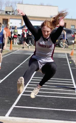 Junior triple jumper Sara Keller comes in for a landing at the Mobridge-Pollock Early Bird Track Meet in Mobridge last Thursday, April 10. Keller claimed top honors in the event with a mark of 33-0.25 and helped the Panther girls to a second place finish in the team standings. Photo by Jon Flatland