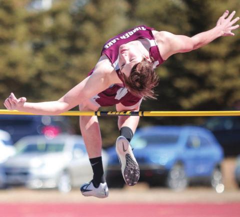 Timber Lake senior Dixon Booth clears the bar during the boys high jump event at the Timber Lake tune-up meet held last week at Doug Kraft Field. Photo by Jon Flatland